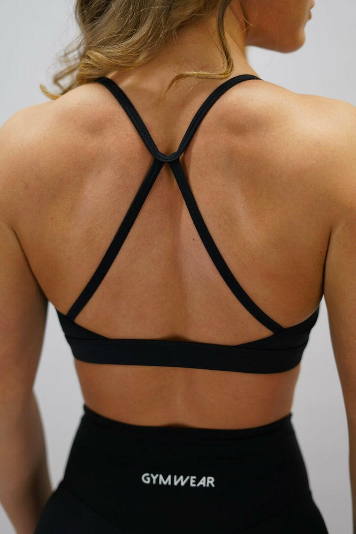 Svart blå Zoe Premium Sport Bra - premium sport-bh med korsade band bak och Gymwear-logga fram