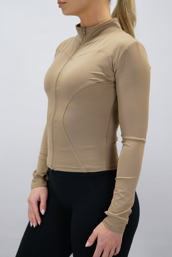 Vit Nalia Performance Long Sleeve Zipper Top - långärmad funktionströja med hel dragkedja, tumhål och Gymwear-logga i nacken
