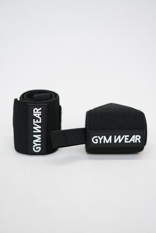 Svart GYMWEAR Wrist Wraps är handleds linda designad för styrketräning, CrossFit, och gym. Den har en justerbar kompressionsstrumpa som ger skadeförebyggande stöd. 