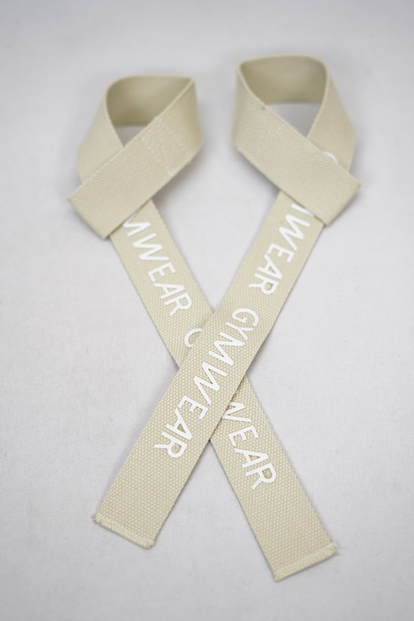 Beige GYMWEAR Lifting Straps med silikon logo för bättre fäste och 100% bomull. Perfekt för tyngsta lyft med extra fäste och komfort.