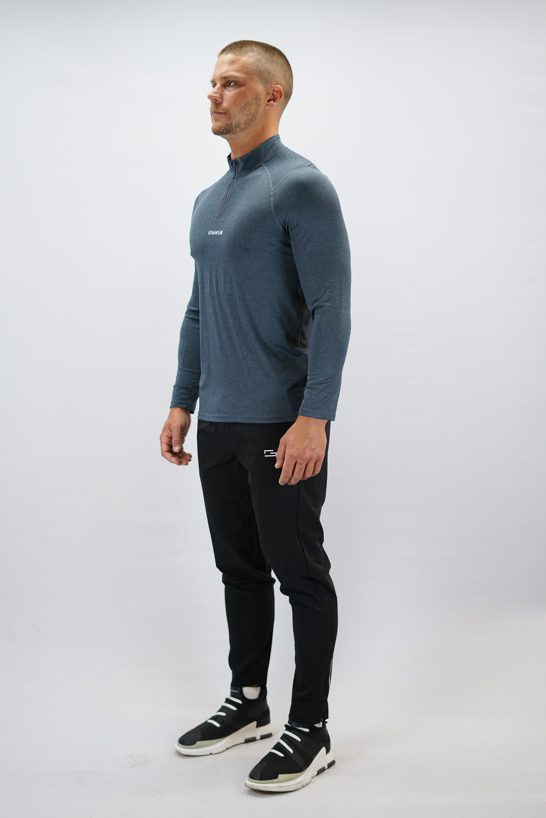 Blågrå Eiden Long Sleeve Half-Zip Top - funktionsmaterial långärmad träningströja med halvdragkedja och Gymwear-logga på framsidan
