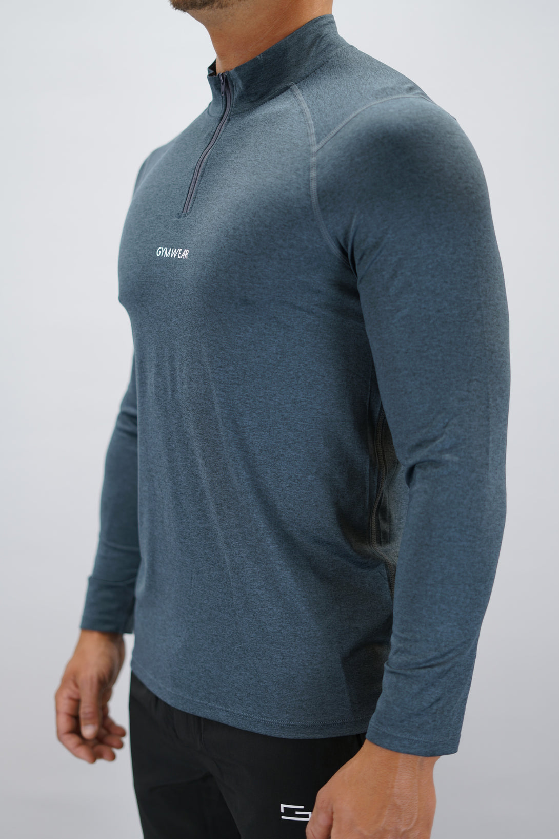 Blågrå Eiden Long Sleeve Half-Zip Top - funktionsmaterial långärmad träningströja med halvdragkedja och Gymwear-logga på framsidan