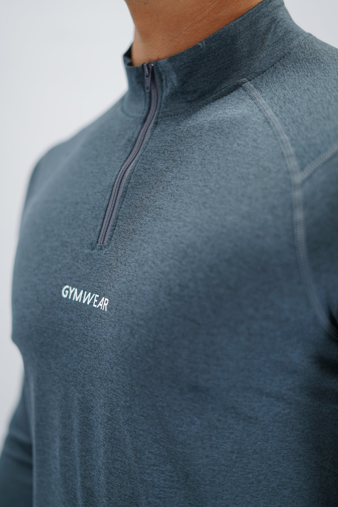 Blågrå Eiden Long Sleeve Half-Zip Top - funktionsmaterial långärmad träningströja med halvdragkedja och Gymwear-logga på framsidan