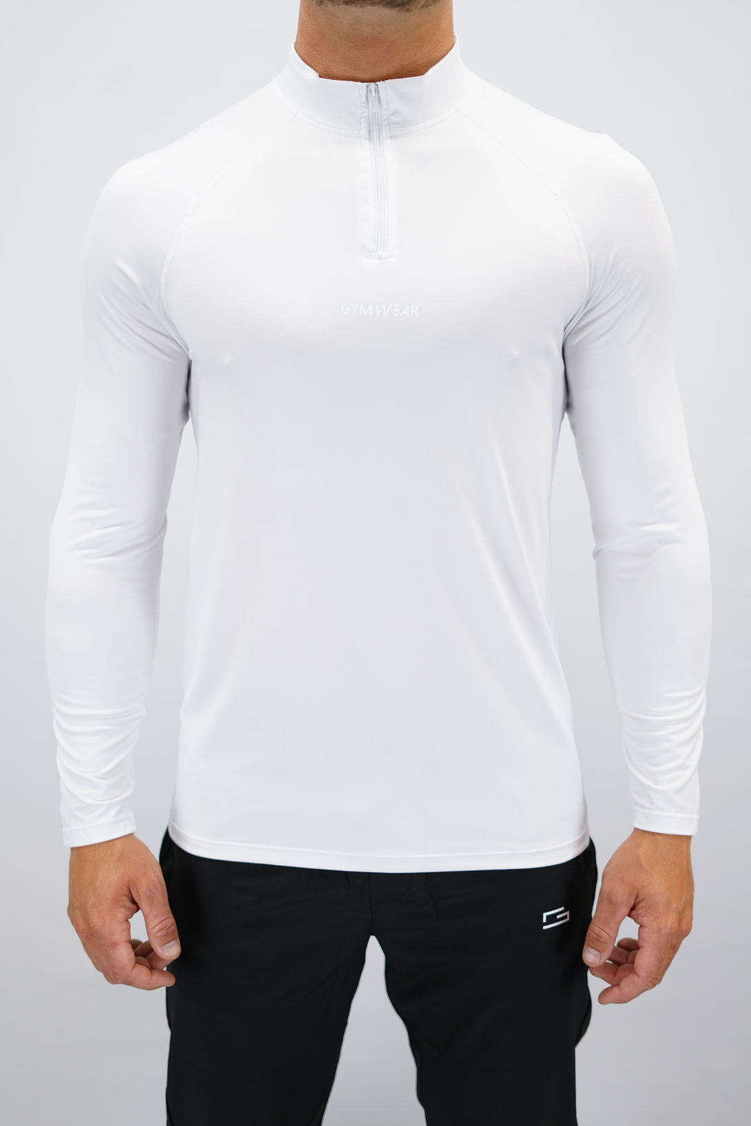 Vit Eiden Long Sleeve Half-Zip Top - funktionsmaterial långärmad träningströja med halvdragkedja och Gymwear-logga på framsidan