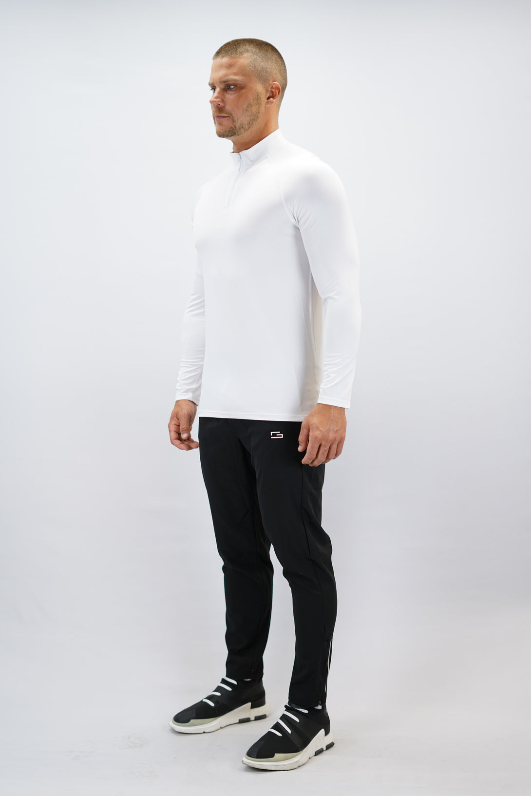 Vit Eiden Long Sleeve Half-Zip Top - funktionsmaterial långärmad träningströja med halvdragkedja och Gymwear-logga på framsidan