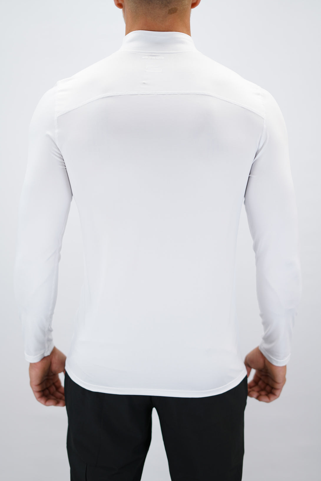 Vit Eiden Long Sleeve Half-Zip Top - funktionsmaterial långärmad träningströja med halvdragkedja och Gymwear-logga på framsidan