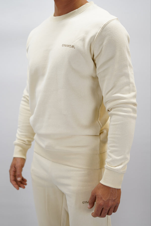 Cleo Sweatshirt herr i mjuk borstad bomull, beige färg, med stilren logga på vänster bröst. Komfortabel och snygg sweatshirt för vardagsbruk.
