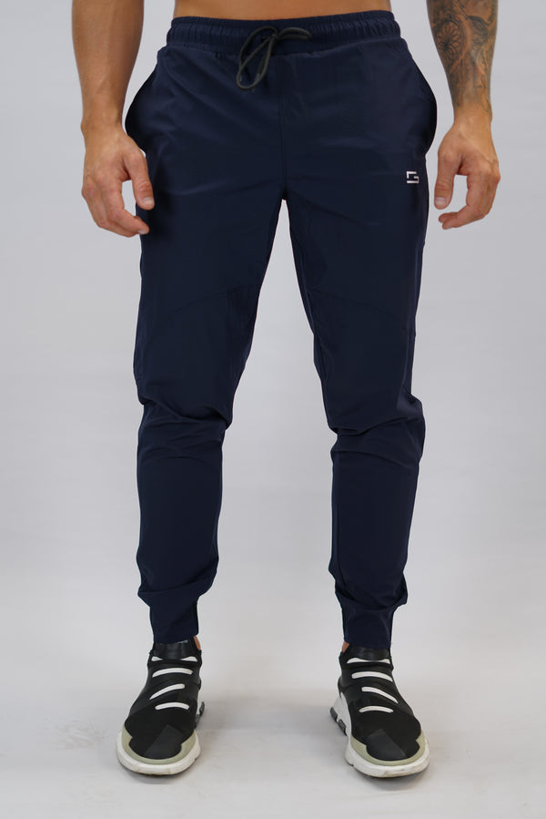 Marinblå Zion Performance Jogger Pants - träningsbyxor i snabbtorkande material med G-symbol på vänster ben