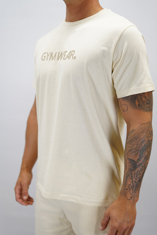Beige Mirch T-Shirt, en kortärmad tränings-t-shirt i mjuk borstad bomull med Gymwear-logotyp på bröstet.