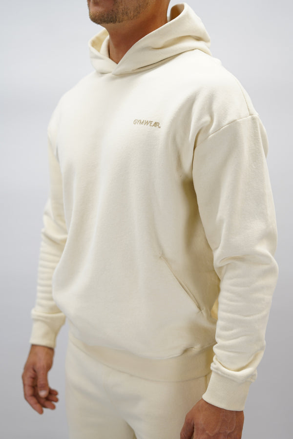 Z-2 Hoodie i beige färg, borstade bomull med GYMWEAR logga på vänster bröst. Snygga diskreta fickor.