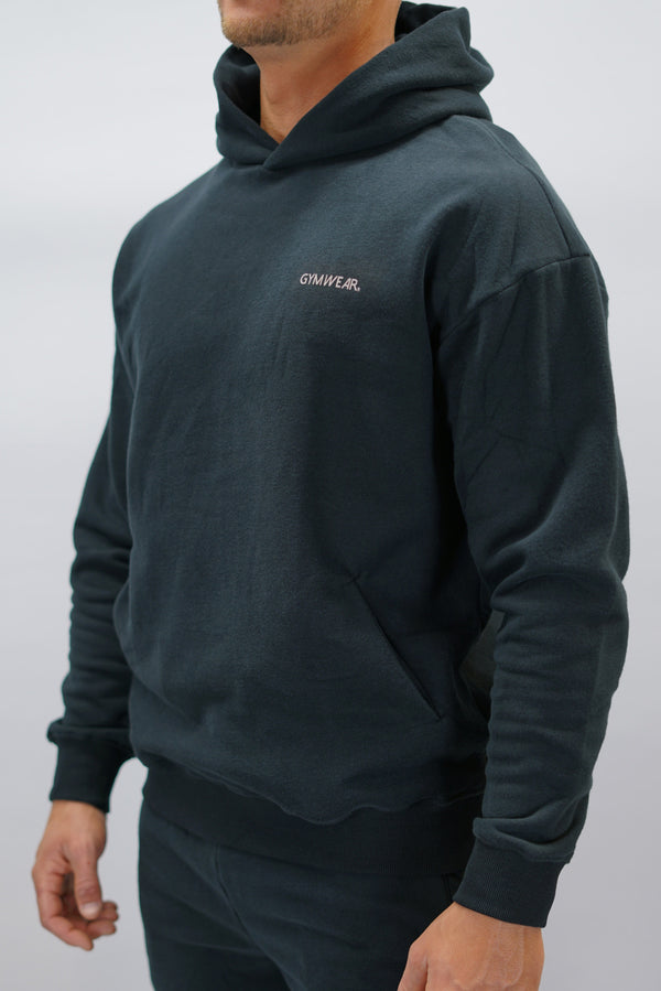 Z-2 Hoodie i svart färg, borstade bomull med GYMWEAR logga på vänster bröst. Snygga diskreta fickor.