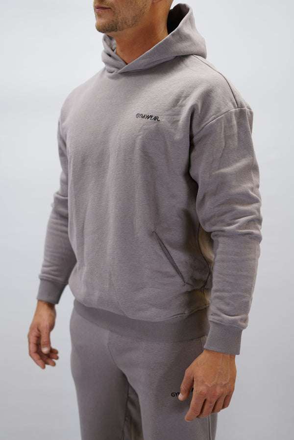 Z-2 Hoodie i zink färg, borstade bomull med GYMWEAR logga på vänster bröst. Snygga diskreta fickor.